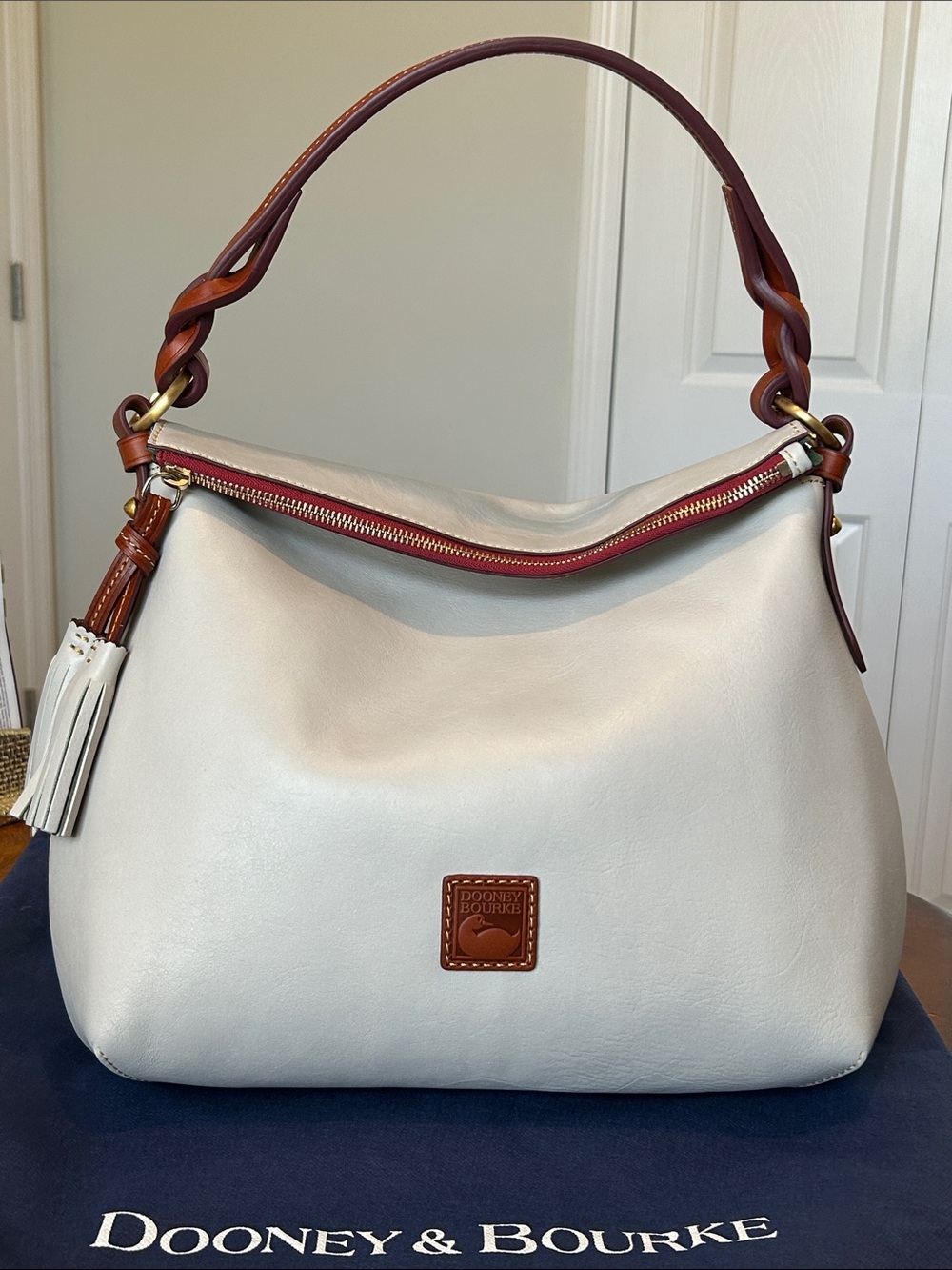 Dooney & Bourke Ecru Leather Hobo with Braided Accent Handle, Tassels